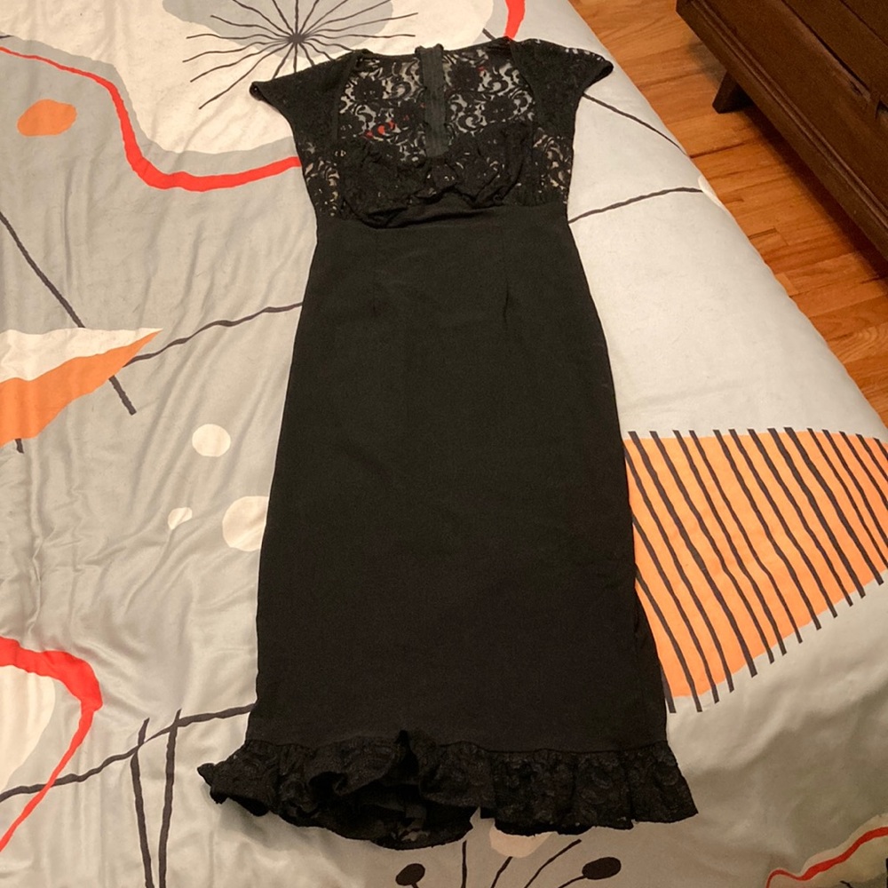 Pinup Couture black wiggle dress with illusion bust and lace ruffle around hem